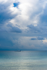 Fototapeta premium Exclusive big white Yacht swimming on the sea with stormy clouds in the background. Koh Rong Samloem, Saracen Bay. Cambodia.