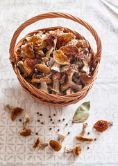 Dried white mushrooms in a beautiful wicker basket on the table
