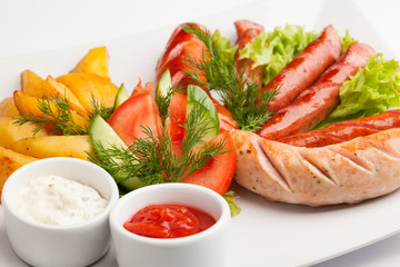 beautiful photo close-up menu of potatoes, sausage salad on a plate on a white background