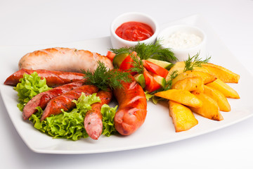 beautiful photo close-up menu of potatoes, sausage salad on a plate on a white background
