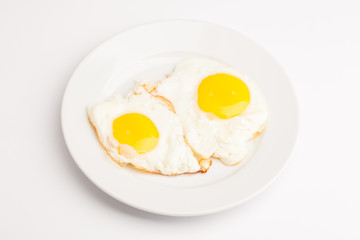 A beautiful photo of a closeup menu of fresh delicious eggs on a plate on a white background