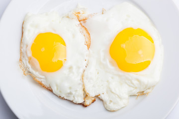 A beautiful photo of a closeup menu of fresh delicious eggs on a plate on a white background