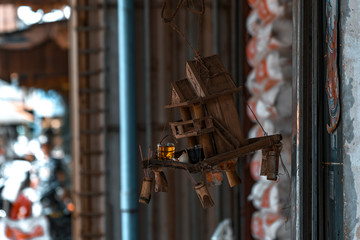 Small Cambodian altar hanged on the wire. 