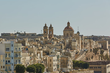 Fototapeta na wymiar View of a coastal area and downtown of Valletta in Malta