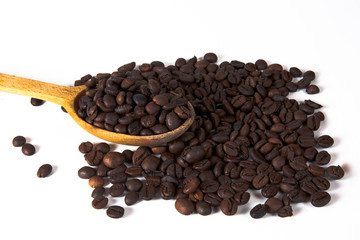 Grain of coffee, beans and spoon.