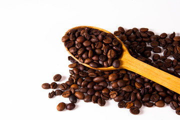 Grain of coffee, beans and spoon. White background