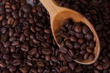Grain of coffee, beans and spoon. White background