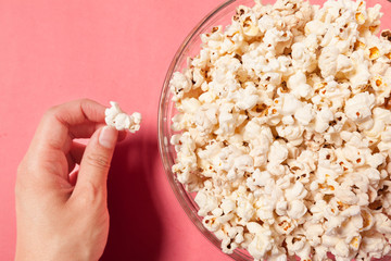 popcorn on color background