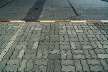 Red and white concrete road curb
