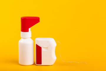 Dental floss on color background