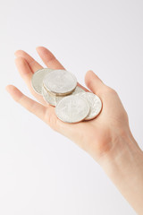 Fototapeta premium cropped shot of woman holding pile of bitcoins isolated on white