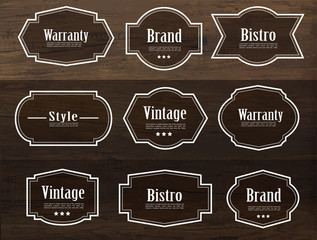 Set of vector vintage style frame labels and elements for design, carve banner on wood texture.