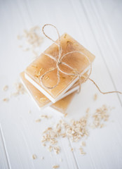 White and beige handmade soap bars with oat flakes
