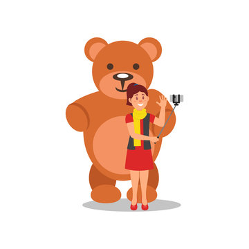 Cheerful young girl making selfie with big brown teddy bear. Woman using smartphone and monopod. Flat vector design