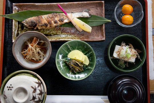 Japan Food Set Of Grill Fish With Salt On Wood Plate, Top View