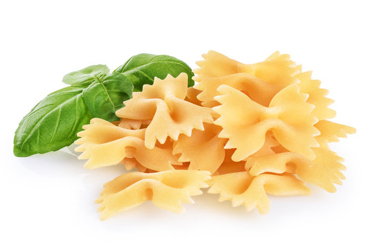 Farfalle pasta and basil isolated on white background. Raw.