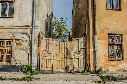  Backstreet Poor Buildings On Street And Wooden Fence