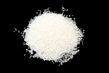 a bunch of white rice isolated on a black background. Chinese cuisine. Traditional food concept..