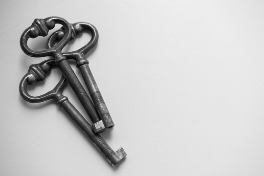 three old vintage key on white background. Antique rusty keys on white background