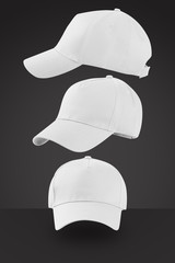 white baseball cap isolated on black background