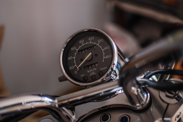 Fototapeta na wymiar Closeup of chopper dashboard and gauges. Shiny chrome details