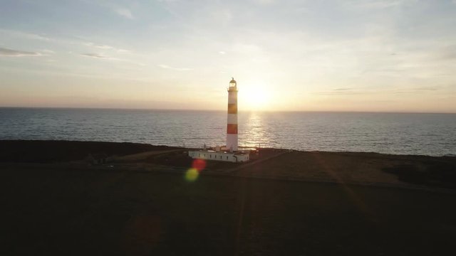 Aerial drone shot of Tarbat Ness lighthouse in Scotland during a sunset