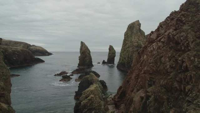 Stunning aerial drone shot of cliffs near Westerwick, Shetland, Scotland