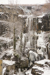 Fototapeta na wymiar Frozen waterfall jets.