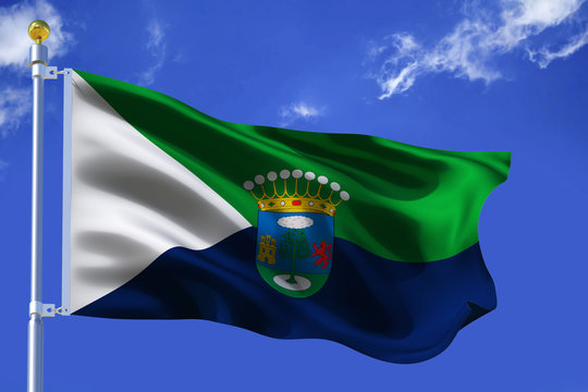 The silk waving flag of El Hierro island with a flagpole on a blue sky background with clouds .3D illustration.