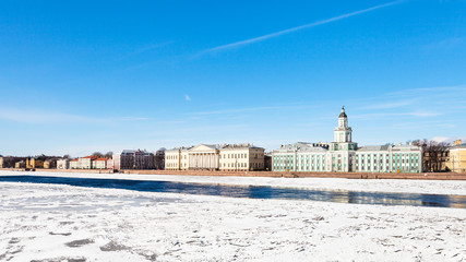 Fototapeta premium view of Universitetskaya Embankment with palaces