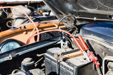 Jump starting old car battery with another vehicle