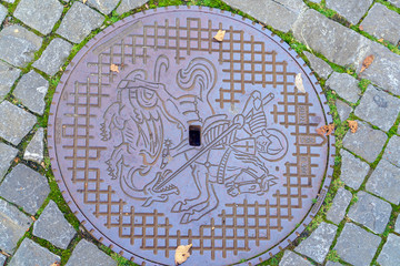 A manhole cover with saint George coat of arms, Stein am Rhein, Switzerland