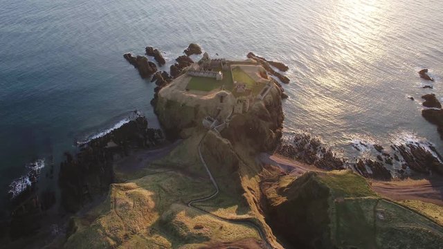Stunning top down aerial drone shot of Dunnottar castle in Scotland