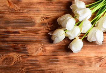 White tulips over old wood background