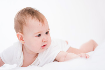 Adorable little baby girl on white background.