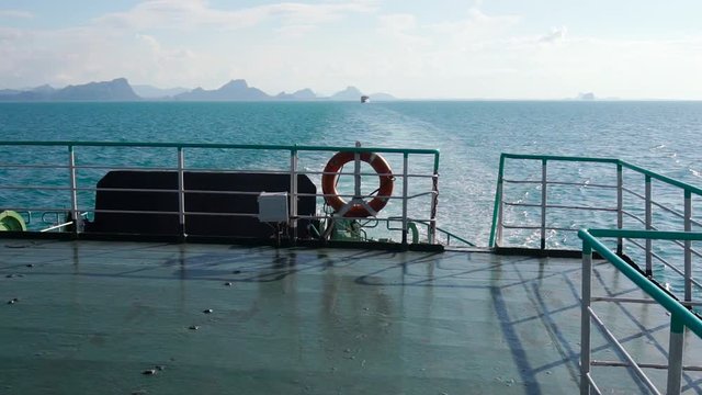 Slow motion camera movement along empty deck of the sailing ship. Dolly shot