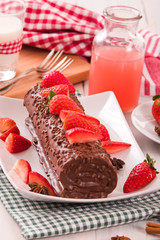 Chocolate roll with strawberries. 