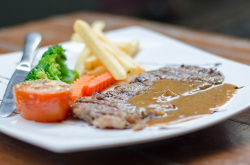Pork steak in white plate