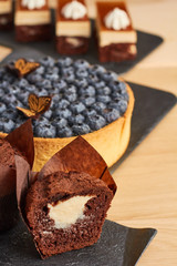 pie with blueberry, chocolate cake and cake with cream cheese