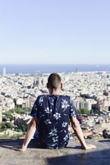 Fototapeta na wymiar young man with Barcelona, Spain, below him