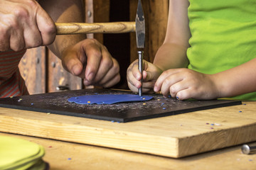 Young Boy and adult Man working together