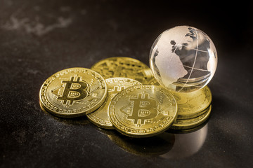 Glass globe and Bitcoin Cryptocurrency. Business concept