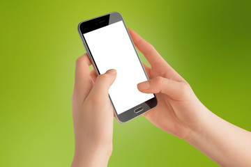 Girl hands holding black smartphone with isolated screen, blurred green color in background, mockup