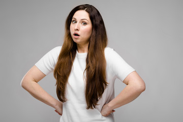 Attractive overweight woman grimacing