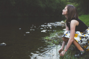 Happy teen girl in the river