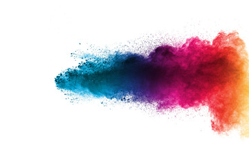 Multi color powder explosion isolated on white background. Color dust splash cloud on white...