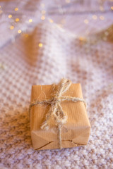 Fototapeta na wymiar Christmas box with craft paper. Christmas tree gift