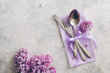 Spring table decoration with lilac flowers
