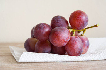fresh grape,Fresh grape  on wooden table with white tissue