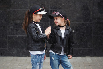 stylish funny little girls on the street